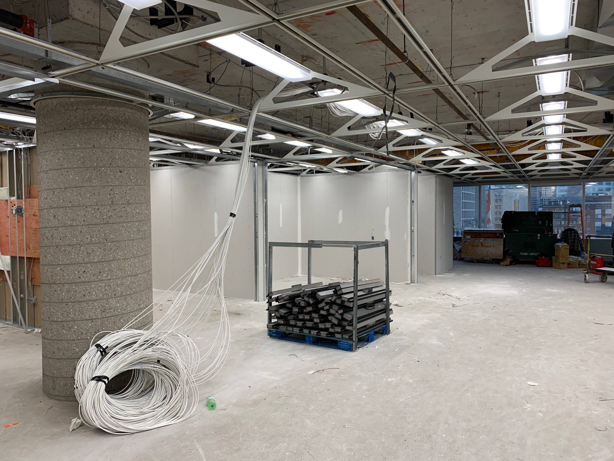 The floor of an office building as structured cabling is being installed.